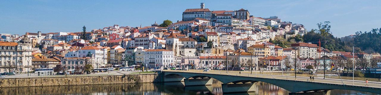 A bridge across the river and the city of Coimbra in Portugal