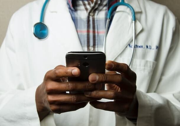 A doctor using a phone 