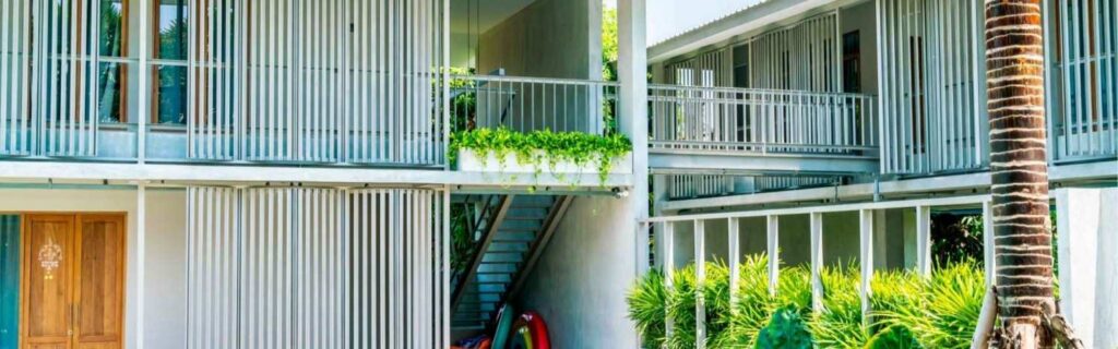 white apartment complex with balconies in dominica