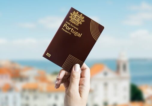 hand holding a Portuguese passport