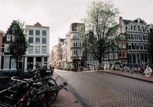 View of a quaint, cobbled bridge with bicycles in Netherlands - Best Country to Immigrate from India in EU region