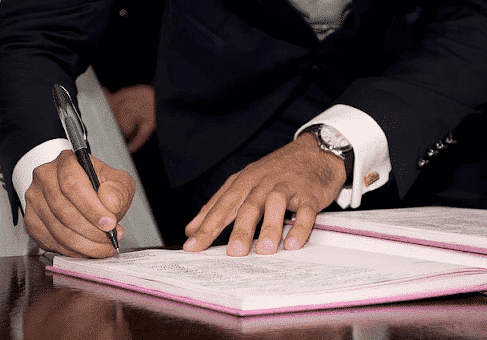 person filling out an application for a grenada work visa
