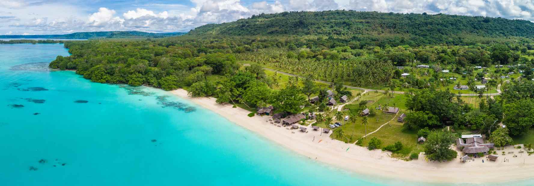 aerial view of a beach and turquoise water in vanuatu