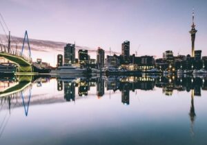 Reflective view of a city in New Zealand next to water - least corrupt countries