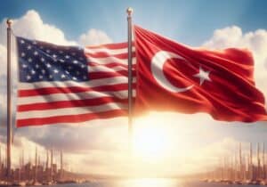 USA and Turkiye flags alongside each other in front of blue sky 