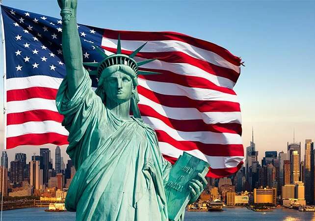 Rendered image of Statue of Liberty in front of a waving American flag and the New York City skyline - renouncement of citizenship in the United States