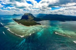 Underwater waterfall in blue-green waters of Le Morne, Mauritius - best retirement places in the world