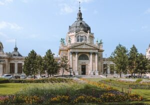 Parliament building in Hungary surrounded by a lush garden - Hungarian Golden Visa