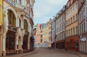 Colorful Art Deco houses line a quiet Latvian street - citizenship and a 2nd passport through investment