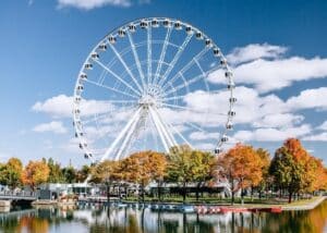 Ferris wheel in Canada with autumn landscape and blue sky