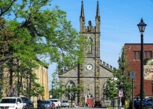 Saint Jonh's church in Canada with trees and cars