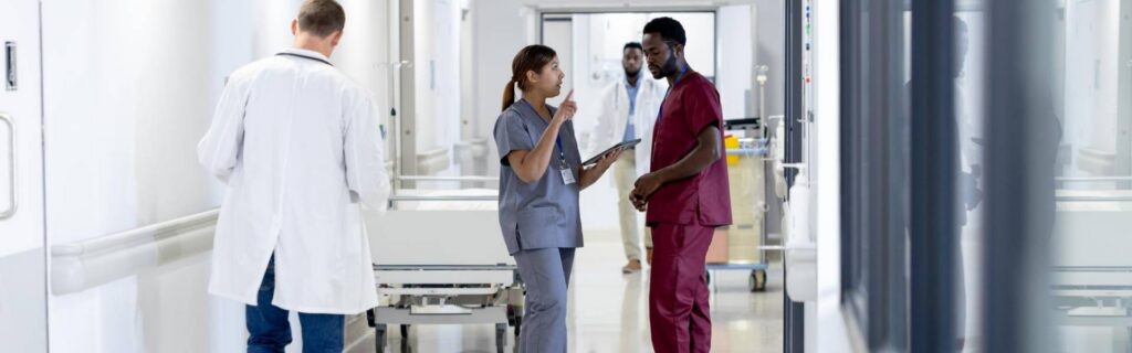 medical staff walking in a hospital corridor