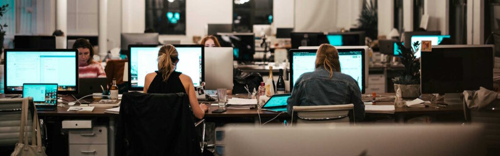 people working on an office under the O1 Visa
