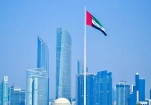UAE flag waving against a city skyline - UAE Golden Visa