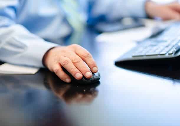Man with a mouse and laptop