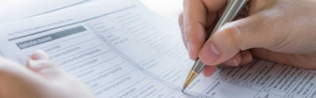 close up of a personal ticking boxes on an eu residence application