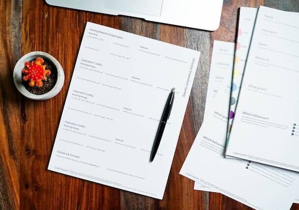 documents on a table describing how invest in Canada works