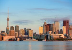 city in canada with tall buildings near water