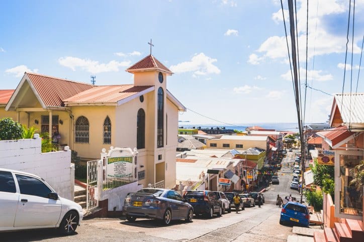 vehicles traveling on a road in grenada