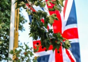 British flag hanging behind green trees - moving to Europe from the UK: post-Brexit