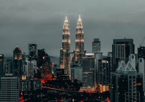 Petronas Towers lit up on a cloudy night - English-speaking countries