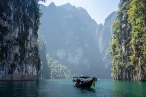 Local tourism boat floating in the ocean near Khao Sok National Park, Khlong Sok, Thailand - Thailand best healthcare for expats
