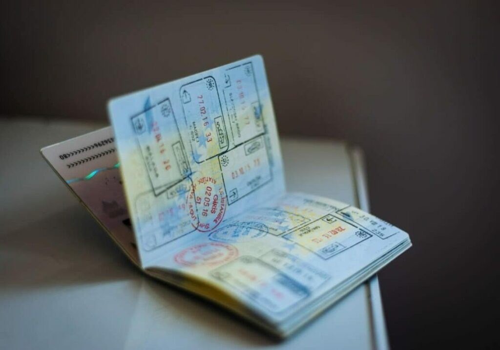 passport with numerous stamps laying open