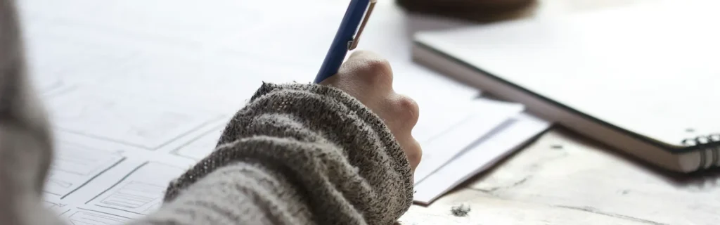 person taking notes under spain education