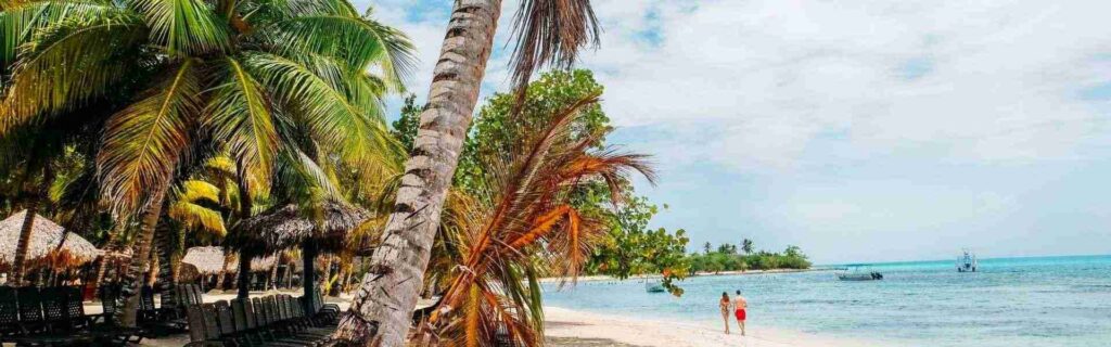 tourists walking down a st lucia beach