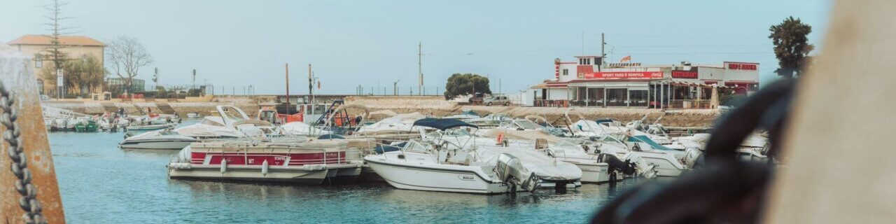 Boats docked in a marina in Faro in the Algarve, Portugal