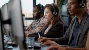 people at their desks at a customer service office in the caribbean