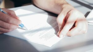 a persona signing documents for a caribbean business
