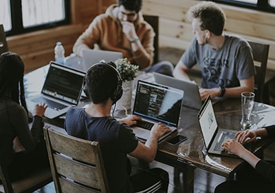 peopler working on computers with the Canada start up visa official website GCS