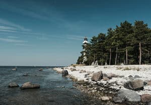 Lighthouse on a rocky beach in Estonia - cleanest countries in the world