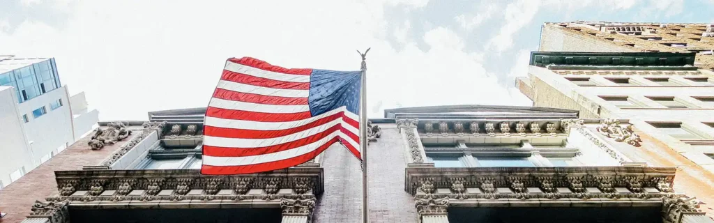 american flag in front of a building