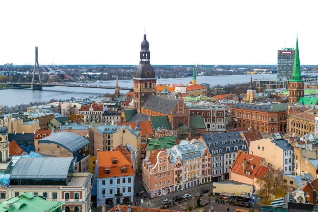 A panoramic view of Riga, Latvia, showcasing its historic architecture and vibrant cityscape under a clear blue sky - retirement-friendly countries for Americans