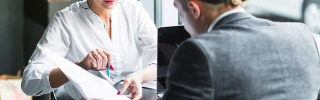 grenada citizenship by investment lawyer consulting a client
