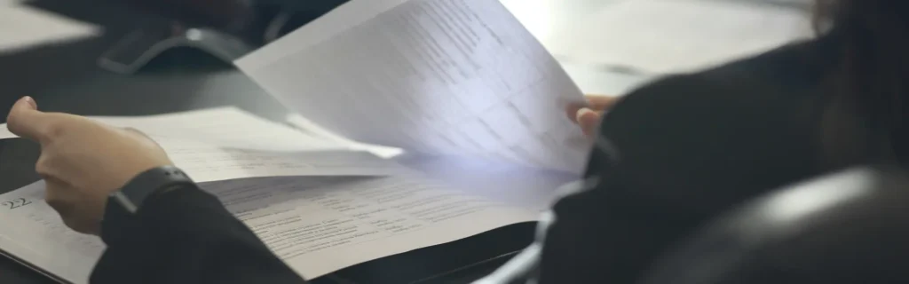 person holding documents