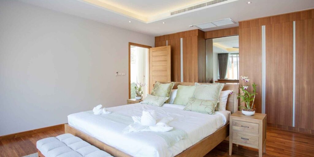 a luxury bedroom with a tropical design