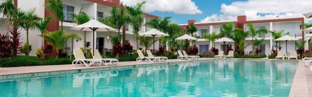 hotel suites around a swimming pool at a resort in st lucia