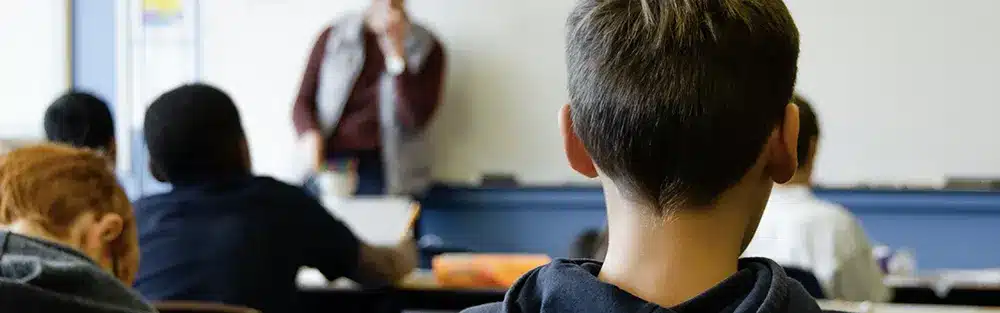 Child sitting in classroom in internation school in Serbia