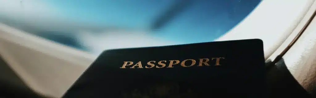 passport on an airplane window