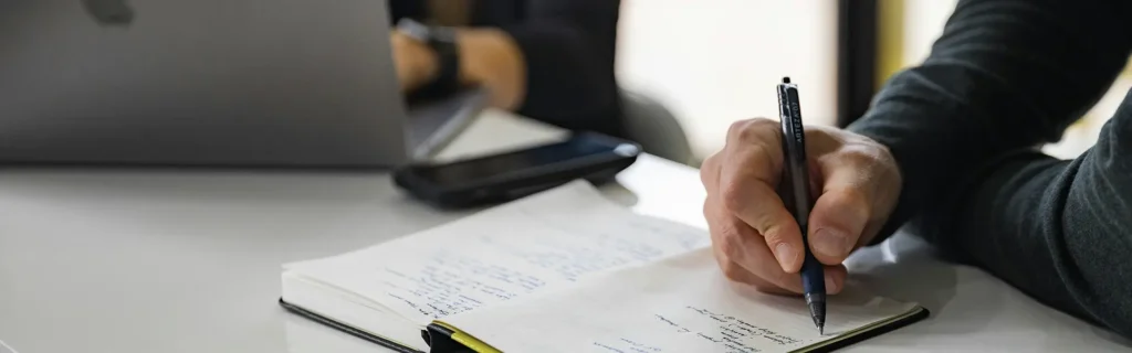 people-writing-meeting-long