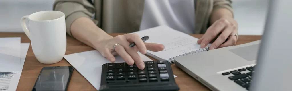 person calculating taxes in argentina