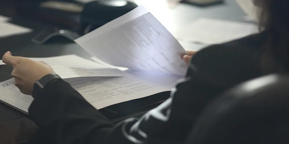 person holding documents