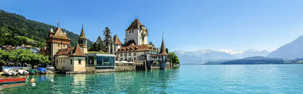 Lake in Switzerland on a bright sunny day - happiest countries in the world