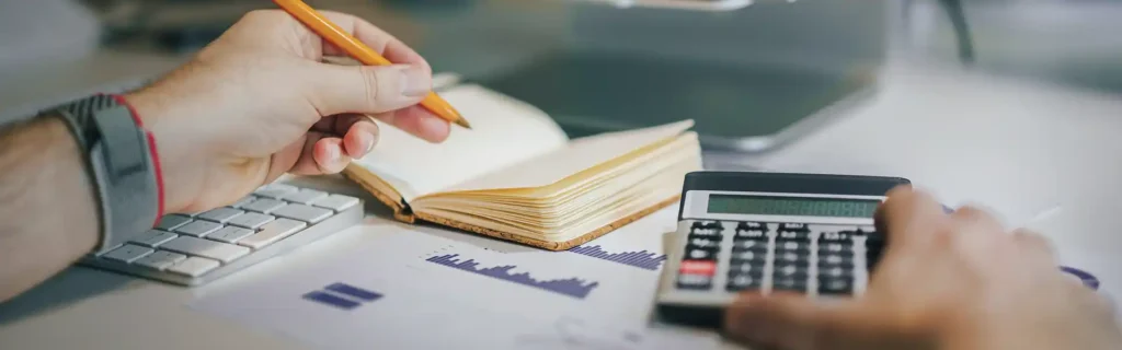 Person checking the Canada Business Immigration Cost