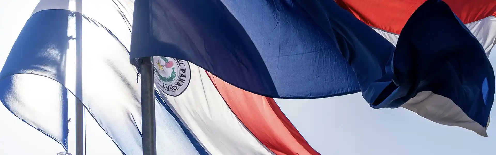 Paraguaisn flags over blue sky
