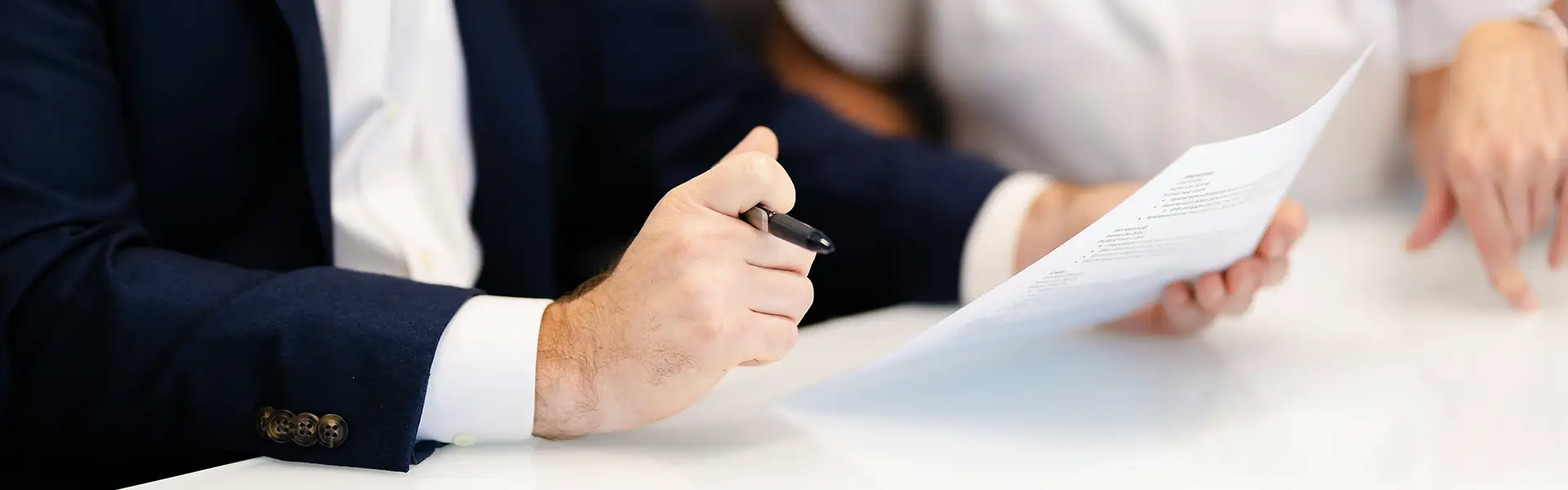 people in a meeting going over citizenship documents